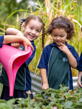 Children watering plants