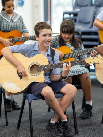 Student learning guitar