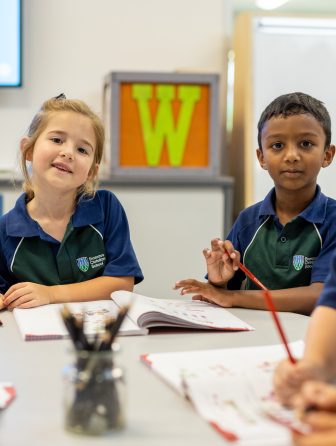 Students writing in workbook