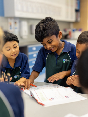 Students reading a book together